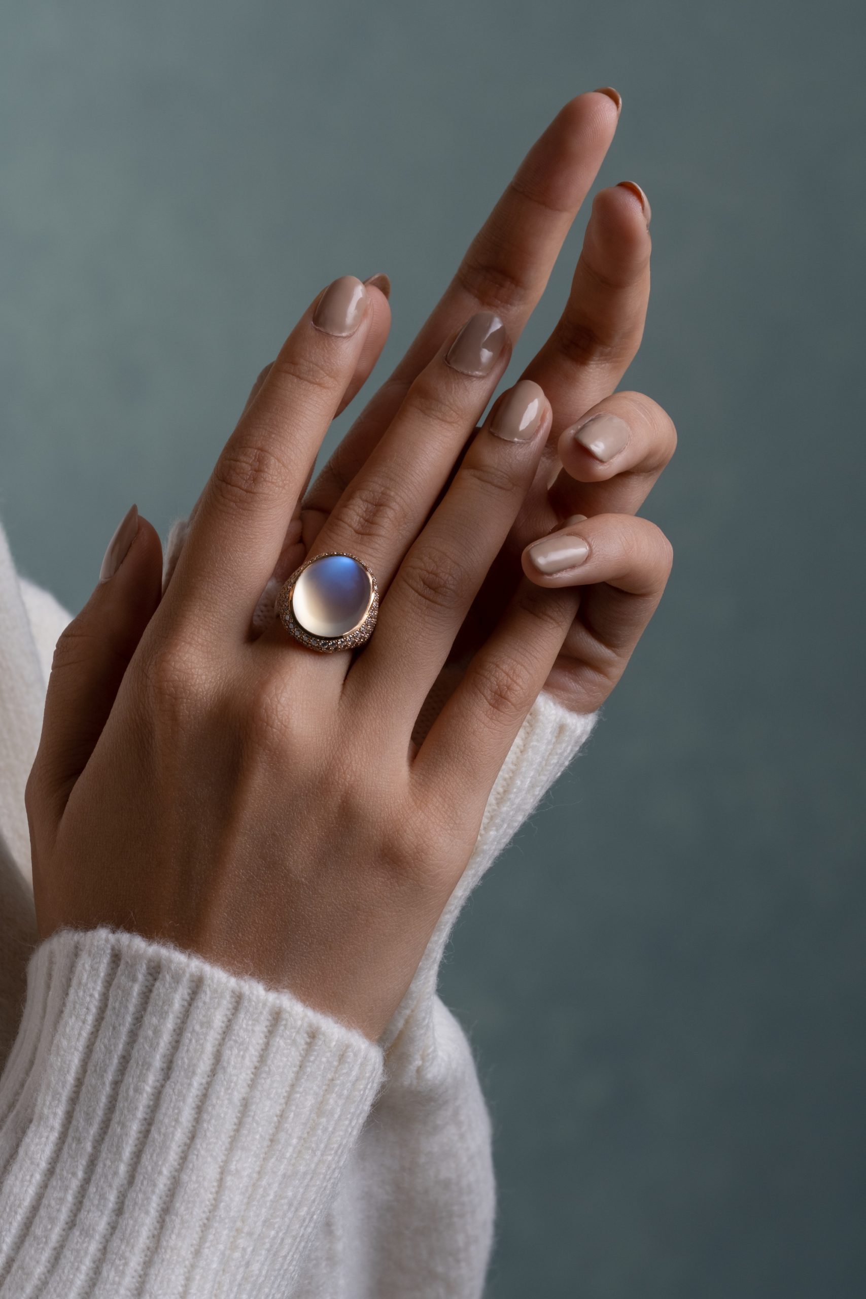 woman's hands wearing a moonstone ring photo for luxury public relations
